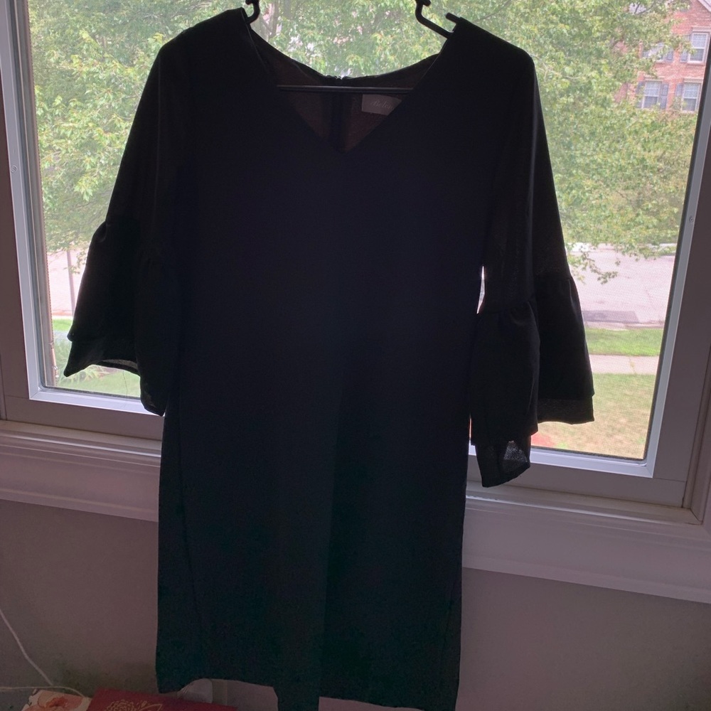 Simple black dress with 3/4 length ruffle sleeve